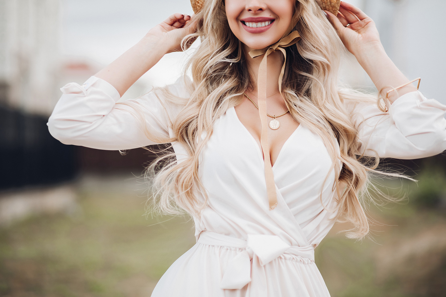 Gorgeous Blonde Woman With Long Wavy Hair Wearing Hat With Bows Showing Some Cleavage