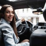 Post Breast Augmentation Driver looking in back seat checking on their recovery.