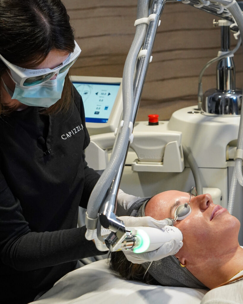 Provider performing HALO laser facial resurfacing for improved tone, texture, and glow.