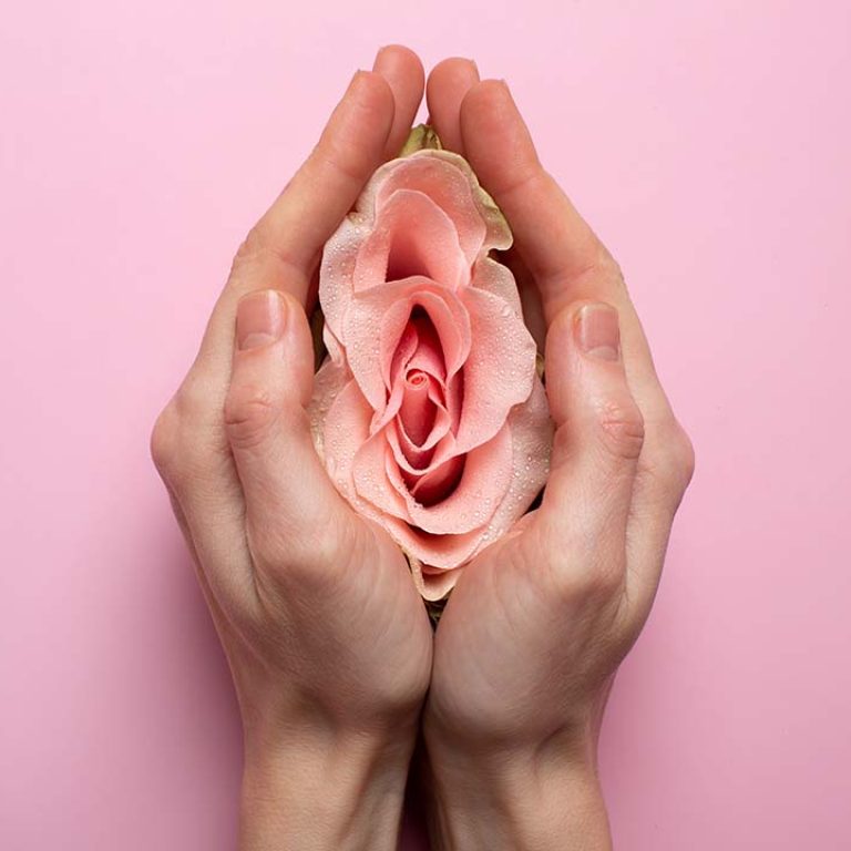 Benefits of Labiaplasty: Woman holding rose in hands.